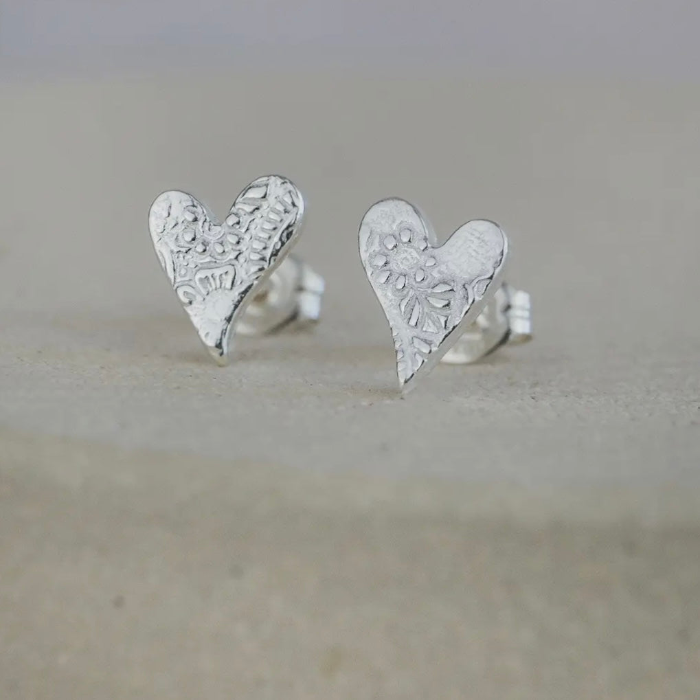 STERLING SILVER TEXTURED STUDS - TILTED HEART