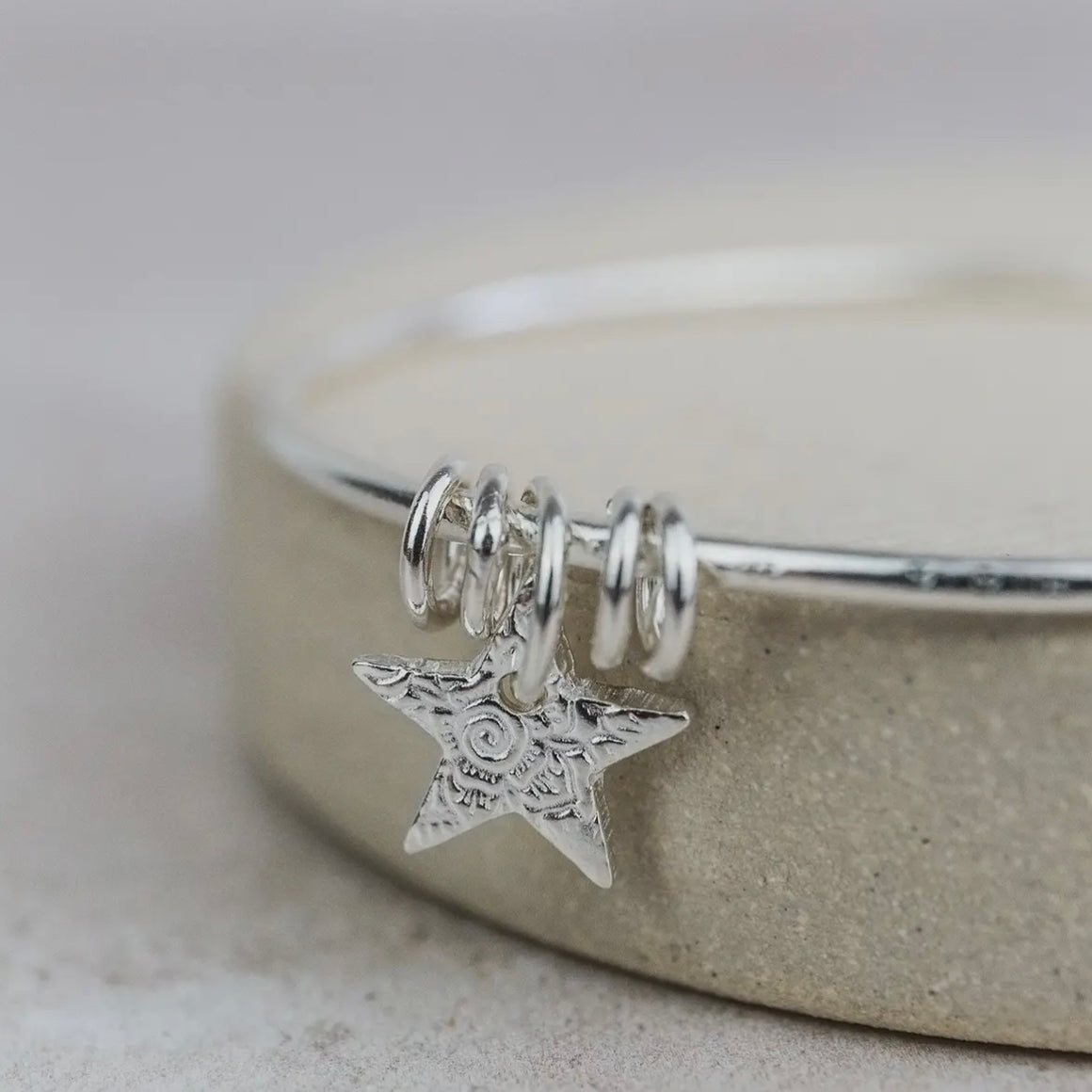 STERLING SILVER TEXTURED STAR CHARM BANGLE